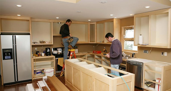 an imag of a kitchen where 2 individuals working